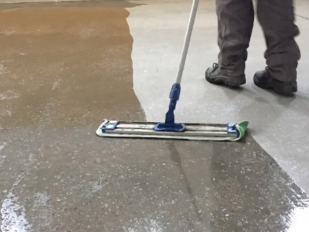 Application of liquid hardener that dramatically improves the surface quality of concrete floors with a single application.