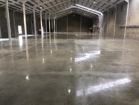 Wet polish to a salt and pepper exposure, anti-dusting hardener, and seal: After.