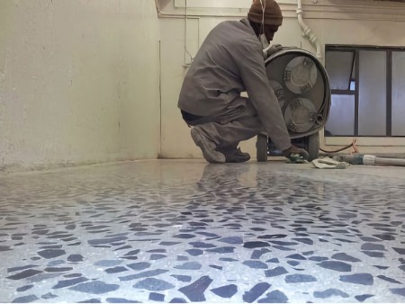 Grind down the concrete to the desired level of exposure and apply a surface protective coating.