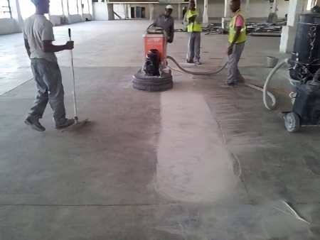 Initial grinding to expose aggregate.